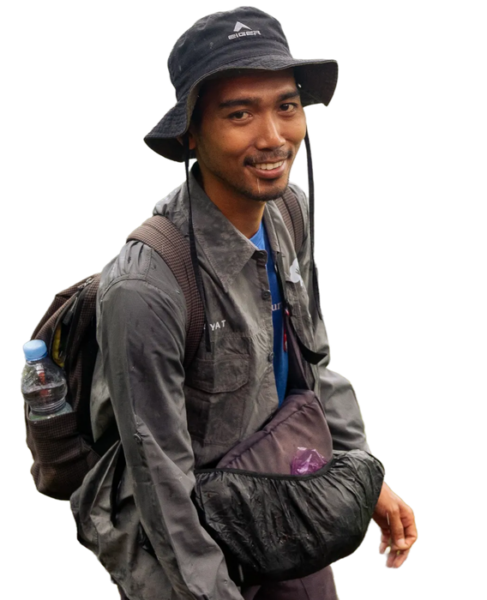 Smiling conservationist with hat and backpack